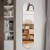 A decorative mirror set is shown on a wall next to a bookshelf, reflecting a room interior. Produktbild-Vorschau