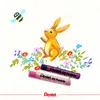 A drawing of a rabbit and a bee in a field of flowers, with two Pentel oil pastels in the foreground. Voir les images du produit