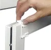 A hand is shown attaching a white plastic clip to a white window frame. Produktbild-Vorschau