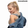 A woman wearing a posture trainer and a denim jacket. Podgląd zdjęcia produktu