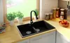 A kitchen sink area with a window view, plants, and jars of food. Produktbild-Vorschau