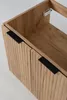 A close-up view of a wooden bathroom cabinet with two doors and black handles. Anteprima dell’immagine prodotto