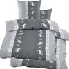 A neatly folded set of bedding with a deer and snowflake pattern.