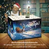 A man in a Santa hat is in the background, and a beer advent calendar is in the foreground with a reindeer and sleigh illustration. Produktbild-Vorschau