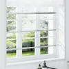 Three adjustable window security bars installed on a window. Náhľad obrázku produktu