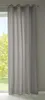 A light gray curtain hangs in front of a window with trees visible outside.