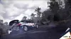 A rally car is drifting on a wet, wooded road. Produktbild-Vorschau