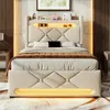A modern upholstered bed with integrated LED lighting in a bedroom setting. Produktbild-Vorschau