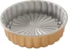 A fluted cake pan with a gold exterior and silver interior. Produktbild-Vorschau