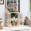 A wooden greenhouse filled with plants on a porch. Náhled obrázku produktu
