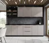 A modern kitchen with light beige cabinets and a dark gray backsplash. Produktbild-Vorschau