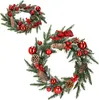 Two Christmas wreaths decorated with pine cones, red berries, and red ornaments. Náhľad obrázku produktu