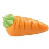 A close-up studio shot of a marzipan carrot decoration. Produktbild-Vorschau