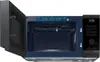 An open microwave with its interior visible and the control panel on the right. Anteprima dell’immagine prodotto