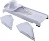 A white mandoline slicer with two interchangeable blades is displayed against a white background. Náhled obrázku produktu
