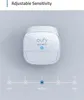 A Eufy security motion sensor is shown with a slider indicating adjustable sensitivity settings from low to high. Produktbild-Vorschau