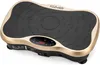 A close-up, angled studio shot of a black and gold vibration plate with a digital display. Náhľad obrázku produktu
