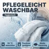 A white duvet is being washed in a washing machine with water splashing. Produktbild-Vorschau