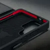A close-up view of the interior of a black phone case with red accents. Produktbild-Vorschau