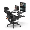 An ergonomic office chair with integrated desk and monitors. Produktbild-Vorschau