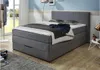 A bedroom scene with a bed, pillows, and a blanket. Produktbild-Vorschau