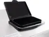 A close-up view of an open black lid on a silver appliance. Produktbild-Vorschau