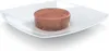 A round, brown food product is presented on a white square plate. Podgląd zdjęcia produktu