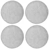 Four round, light gray felt seat cushions are arranged in a two-by-two grid on a white background.