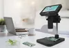 A digital microscope set up on a desk next to a laptop, with electronic components and a plant in a petri dish. Produktbild-Vorschau