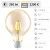 A close-up product shot of a clear, amber-colored globe-shaped LED light bulb with a silver screw base, set against a white background. Technical specifications and icons are displayed to the right of the bulb. Náhľad obrázku produktu