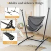 A hammock chair with a stand, set up indoors in a bedroom. Náhled obrázku produktu