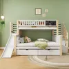 A children's bunk bed with a slide and stairs, set in a bedroom with green walls and decorative pictures. Náhled obrázku produktu
