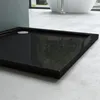 A close-up view of a black square shower tray in a modern bathroom setting. Produktbild-Vorschau