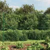 A green chain-link fence in a garden setting. Produktbild-Vorschau
