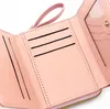 A close-up view of the interior of a pink wallet, showing card slots and a clear ID window. Anteprima dell’immagine prodotto