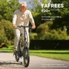 An older man riding an electric bicycle on a paved path in a park. Produktbild-Vorschau