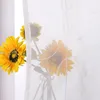 Sunflowers in a vase behind a sheer curtain. Produktbild-Vorschau