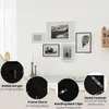A wall with several framed pictures and details about the frames. Produktbild-Vorschau