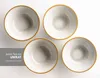 Four ceramic bowls with an orange rim, arranged on a white background. Produktbild-Vorschau