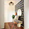 A hallway with a bench, rug, mirror, and a ceiling light. Náhľad obrázku produktu