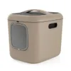 A studio shot of a beige cat litter box with a gray door and a black handle on top. Anteprima dell’immagine prodotto
