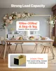 A gold arch stand decorated with flowers is set up behind a dining table with food and chairs. Voir les images du produit