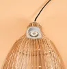 Close-up of the top of a woven pendant lamp with a small LED light fixture attached. Produktbild-Vorschau