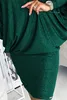 A close-up shot of a person wearing a green sparkly dress. Anteprima dell’immagine prodotto