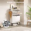 A white shoe cabinet with two flip-down drawers, an umbrella hanging on the side, and a robot vacuum cleaner on the floor. A circular inset shows a pile of shoes. Produktbild-Vorschau