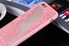A close-up shot of a pink phone case with a lace-like pattern. Produktbild-Vorschau