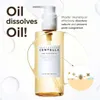 A bottle of SKIN1004 Madagascar Centella Light Cleansing Oil is shown with marketing text and a diagram illustrating its function. Voir les images du produit