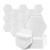 A collection of white hexagonal acoustic panels, with one panel peeling off its backing. Produktbild-Vorschau