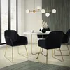 A dining set with black velvet chairs and a marble-top table in a modern room. Náhľad obrázku produktu