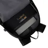 Close-up view of the inside of a black backpack, showing a laptop compartment and a label. Produktbild-Vorschau